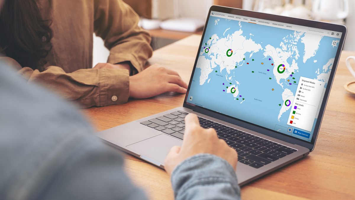 Laptop with the screen showing the map of the world